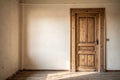 Close-up of closed wooden door in empty room Royalty Free Stock Photo