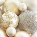 Close-up closeup of beautiful, fancy, elegant, silver, white and gold Christmas baubles ornaments. Luxury holiday decorations