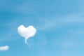 Clouds heart shaped patterns on bright blue sky background , copy space
