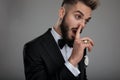 Close up of a clumsy groom picking his nose