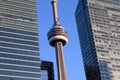 Close up of the CN Tower between two office buildings in downtown Toronto, Ontario, Canada