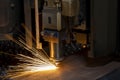 Close up cnc lasercutting of sparks fly out machine head for metal processing at the factory. Au Royalty Free Stock Photo