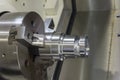 Close up of the CNC lathe jaw clamping raw material steel rod . Royalty Free Stock Photo