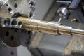 Close up of the CNC lathe Turning machinecutting brass shaft Royalty Free Stock Photo