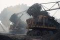 close-up of coal mining equipment, with smoke and dust in the air Royalty Free Stock Photo