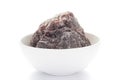 Close-up of coarse Himalayan Black Salt sodium chloride edible on white ceramic bowl.