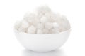 Close-up of coarse sea Salt sodium chloride edible on white ceramic bowl. Royalty Free Stock Photo