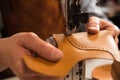 Close up of a cobbler stitching a part of shoe Royalty Free Stock Photo