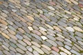 Close up of cobblestone pavement background in grey