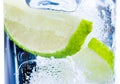 Close-up of cocktail glass with ice and lime slice isolated Royalty Free Stock Photo