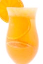 Close up of cocktail glass of orange juice with peaces of orange inside