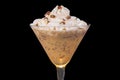 Close up of a cocktail served in a martini glass with a dollop of whipped cream with chocolate shavings Royalty Free Stock Photo