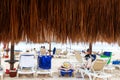 Coconut Palm Leaf Beach Umbrella With Beachgoers in Mexico