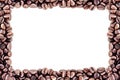Coffee background. Heap roasted coffee beans spread over on table on four side on white background.