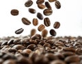 Close-up of coffee beans falling into a pile of coffee beans on a white background with varying shapes and sizes, and intense Royalty Free Stock Photo