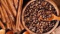 Close up of coffee beans in wooden bowl and cinnamon Royalty Free Stock Photo