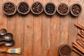 Close up of coffee beans in wooden bowl and cinnamon Royalty Free Stock Photo