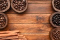 Close up of coffee beans in wooden bowl and cinnamon Royalty Free Stock Photo