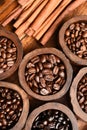 Close up of coffee beans in wooden bowl and cinnamon Royalty Free Stock Photo