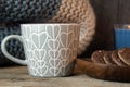 Close-up of coffee cup, biscuits and knitted blanket, rustic Royalty Free Stock Photo