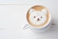 Close up of a coffee cup with a dog shaped latte art