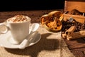 Close-up of coffee cup, dried orange fruit and cinnamon sticks Royalty Free Stock Photo