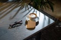 Close up of coffee cup, glasses and business cards on dark wooden table Royalty Free Stock Photo