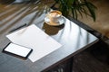 Close up of coffee cup ,glasses, paper, pen and mobile phone with blank screen Royalty Free Stock Photo