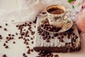 Close-up of coffee cup with roasted coffee beans on wooden background. Royalty Free Stock Photo