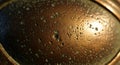 Close-up of a coffee cup\'s surface with bubbles and reflections Royalty Free Stock Photo