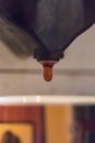 Close up of coffee drops falling to espresso cup