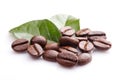 Close up coffee grains and leaves on white background Royalty Free Stock Photo