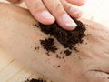 Close up coffee hand scrub with ground coffee Royalty Free Stock Photo