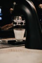 Close-up of Coffee made in professional espresso machine pouring into a cup. Royalty Free Stock Photo