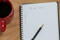 Close-up of coffee mug with diary and pen Royalty Free Stock Photo