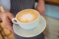 Close-up of coffee served by waitress at cafe Royalty Free Stock Photo