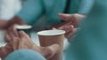 Close up of coffee on the table and businessman`s hands. A man drinking coffee at a meeting with customers. Pleasant Royalty Free Stock Photo