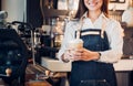 Close up on coffee take away cup with asian woman owner barista