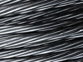 Close up of coiled metal cable industrial background