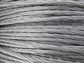 Close up of coiled metal cable industrial background