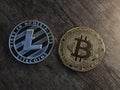 Close up of litecoin and bitcoin on wooden Royalty Free Stock Photo