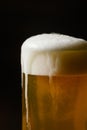 Close-up of cold beer with foam in a mug a dark background Royalty Free Stock Photo