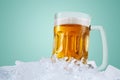 Close up of cold beer in a glass on stack of ice Royalty Free Stock Photo