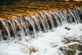 Close up of a cold stream of fresh water from mountain river, rapids, whitewater