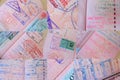 close up collage of pages of foreign passport with foreign visas, border stamps, permits to enter countries, concept of traveling Royalty Free Stock Photo