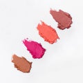 Close-up of a collection of colorful lipstick samples on a white background Royalty Free Stock Photo