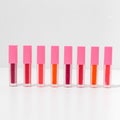 Close-up of a collection of colorful lipstick samples on a white background