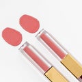 Close-up of a collection of colorful lipstick samples on a white background