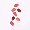 Close-up of a collection of colorful lipstick samples on a white background Royalty Free Stock Photo