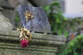 Close-up of a collection of grey stones in a cemetery, with a red rose Royalty Free Stock Photo